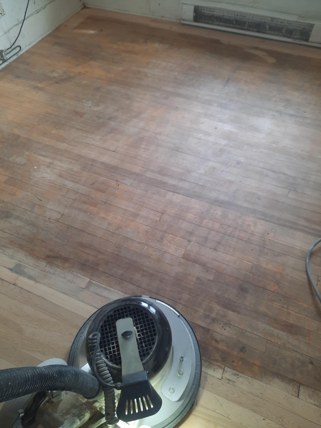 sander passing over old hardwood floor